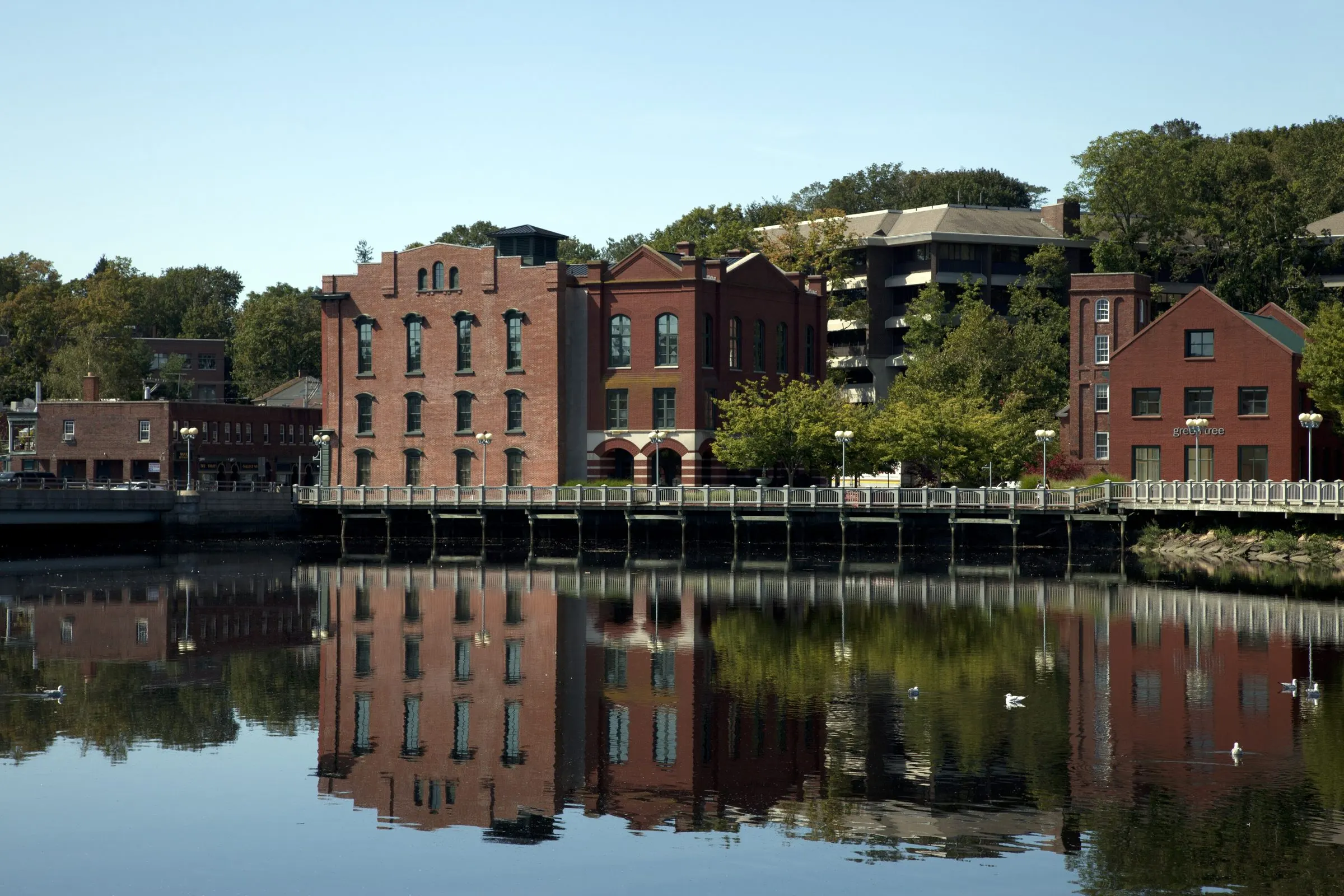 National Hall and neighboring brick buildings on the Saugatuck River in downtown Westport