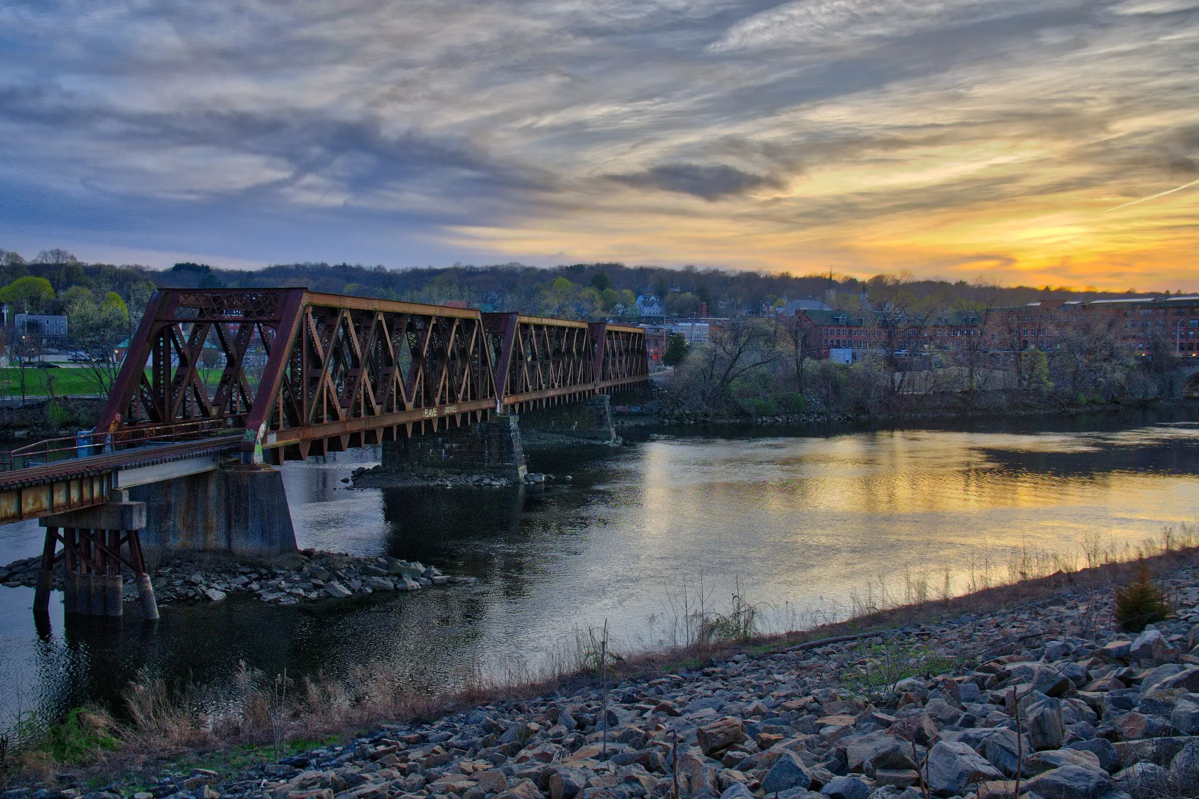 Sunset over the Housatonic River seen from Derby, with the old railroad truss bridge crossing the water